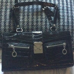 Guess purse. Like new. Silver hardware.12” wide, 6 and a half inches tall.Beauty